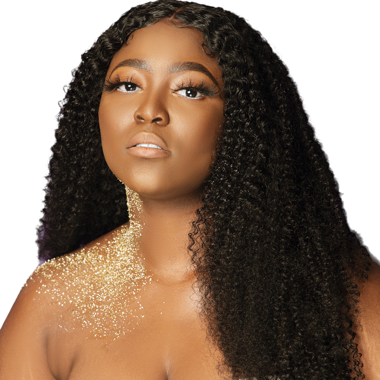 Woman with long, curly black hair and gold glitter on shoulders against a white background